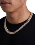 Model wearing 13mm 18K gold ice prong cuban necklace by Iceman Society, side view