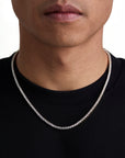 Model wearing 3mm 18k gold tennis necklace by Iceman Society, front view
