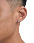 Model wearing white gold diamond earrings by Iceman Society