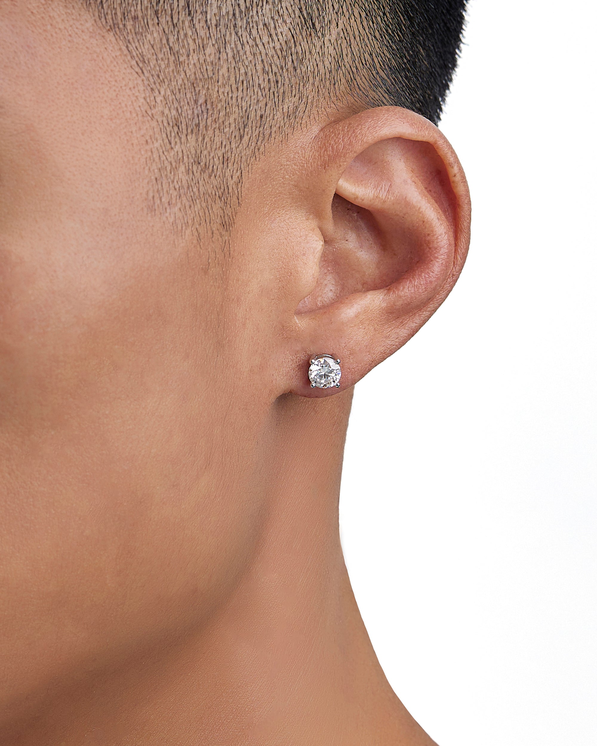 Model wearing white gold moissanite earrings by Iceman Society