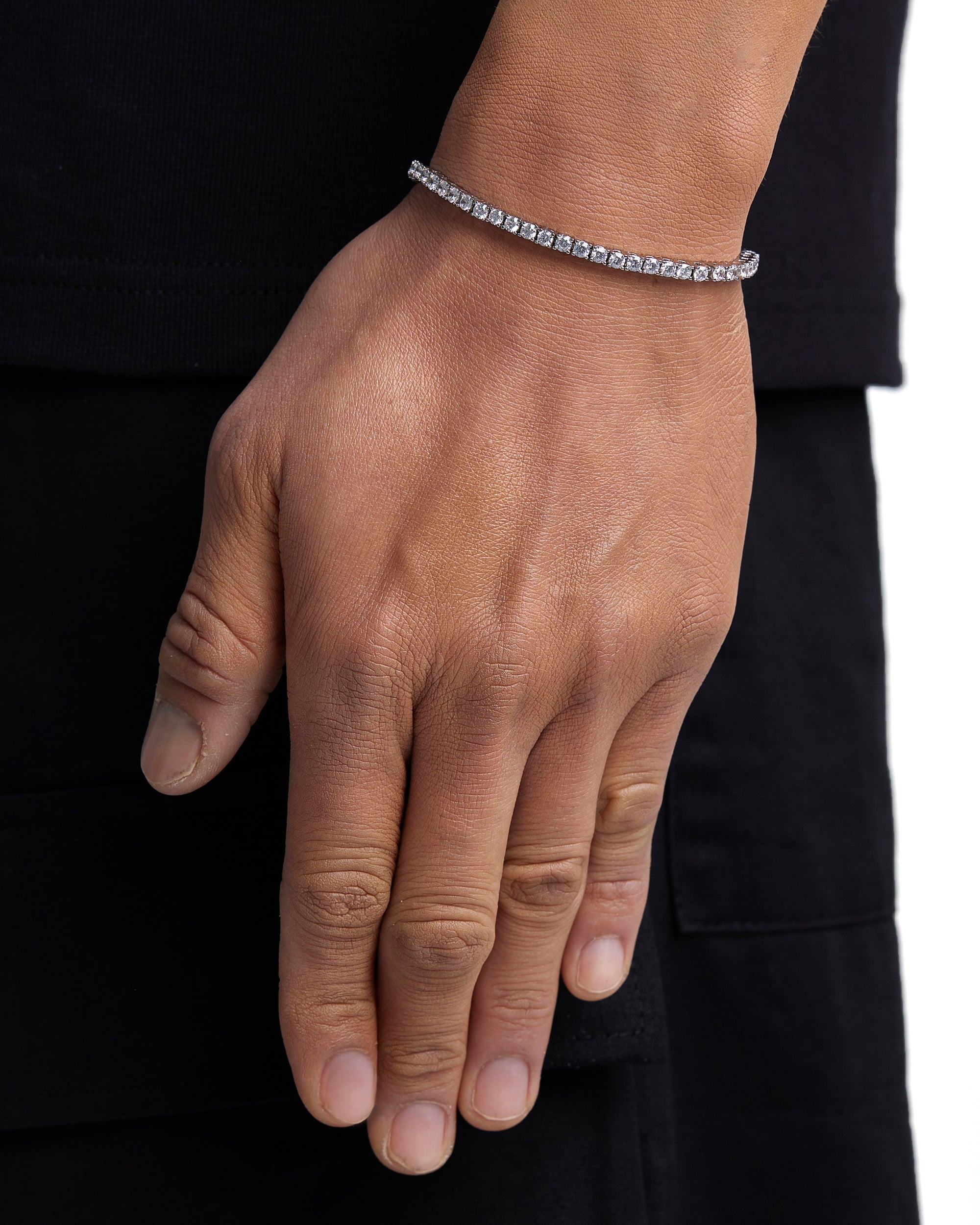Model wearing 3mm white gold tennis bracelet by Iceman Society