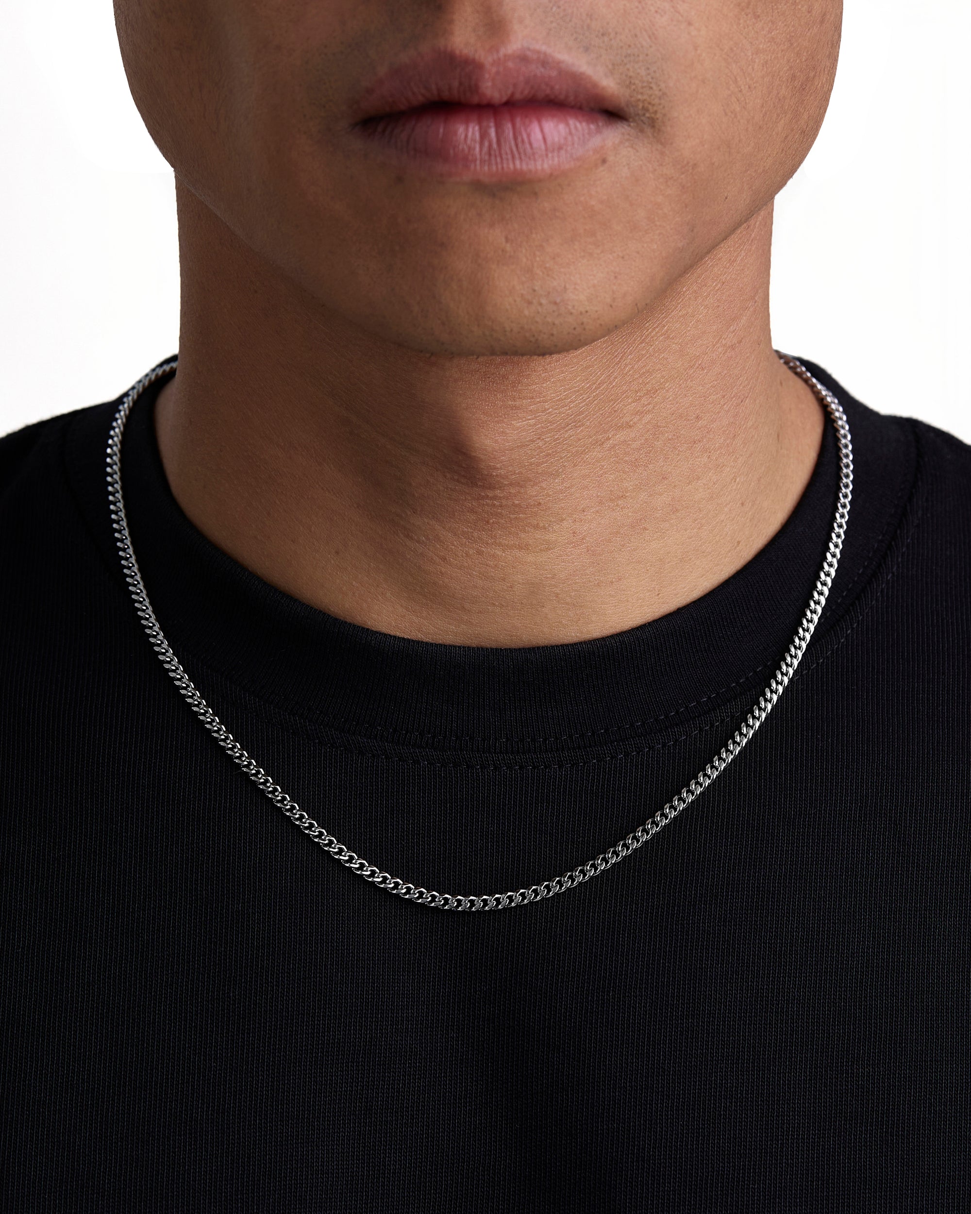 Model wearing 3mm white gold plain cuban necklace by Iceman Society