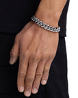Model wearing 12mm white gold plain cuban chain set by Iceman Society, side view